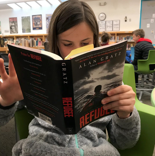 Student Reading Refugee